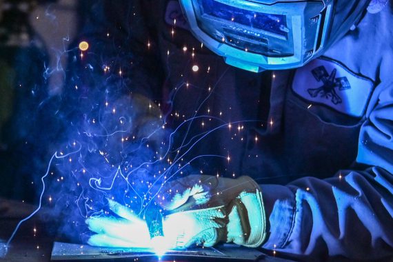 Orlando Cepeda, 90th Logistics Readiness Squadron mobile metal mechanic, welds a piece of metal on F.E. Warren Air Force Base, Wyo., Nov. 29, 2022. With more than 40 years of experience, the 90th LRS Monster Garage or body shop team repairs the 90th Missile Wing fleet while supporting the Air Force Global Strike priority of people by finding ways to train the next generation of Airmen and find innovative solutions. (U.S. Air Force photo by Joseph Coslett Jr.)